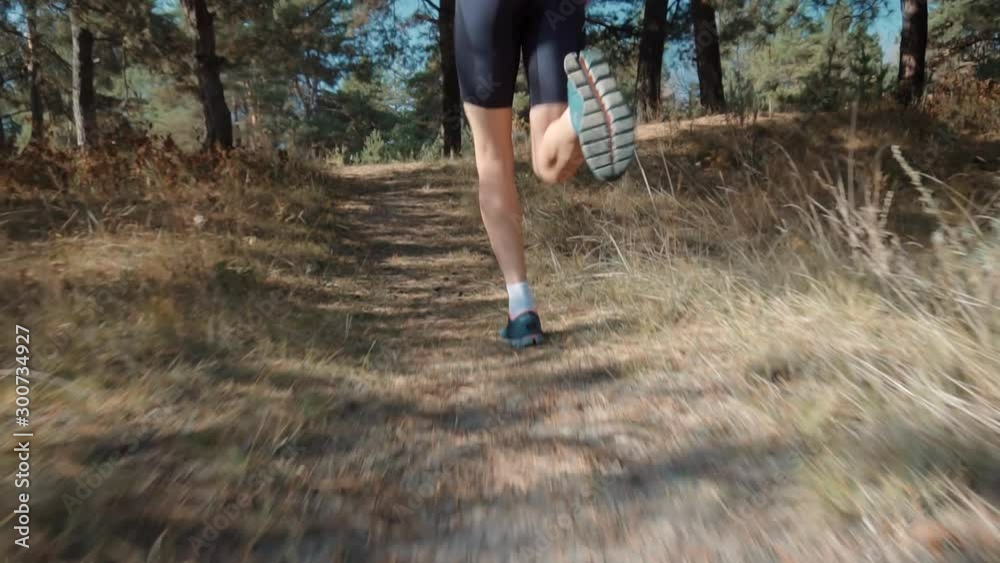 Runner Man Running And Preparing To Triathlon Marathon And Sprinting In Park On Fall.Running Man On Forest Road Half Marathon.Triathlete Ready For Marathon And Hard Training Before Running Competition