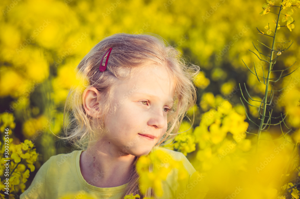 adorable charming blond girl in yellow meadow adorable charming blond girl in yellow meadow