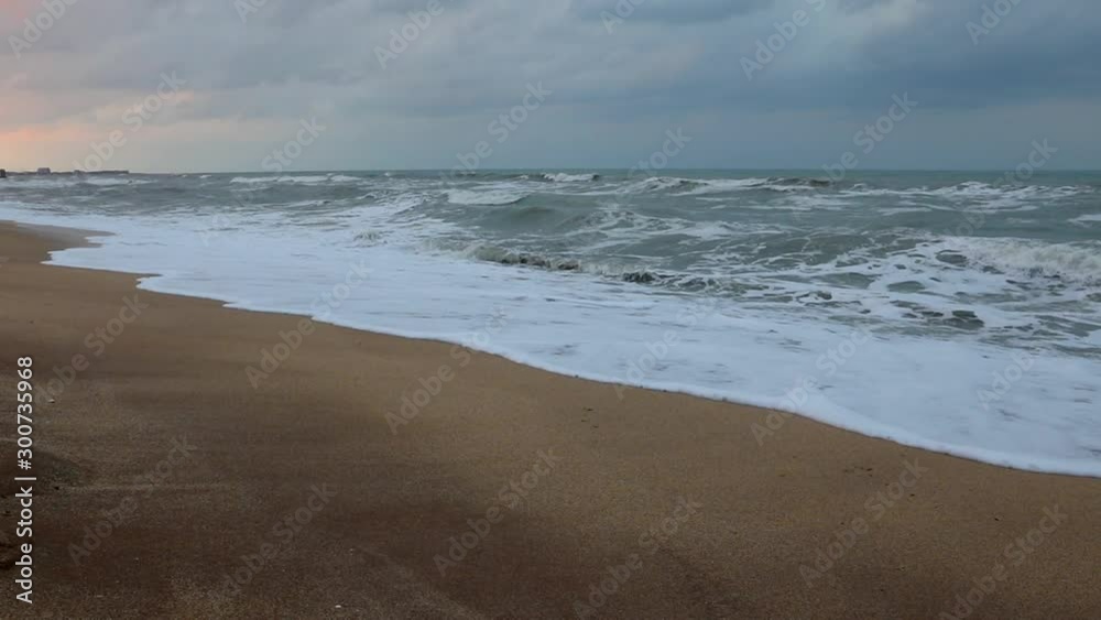 Stormy sunset on the sea coast
