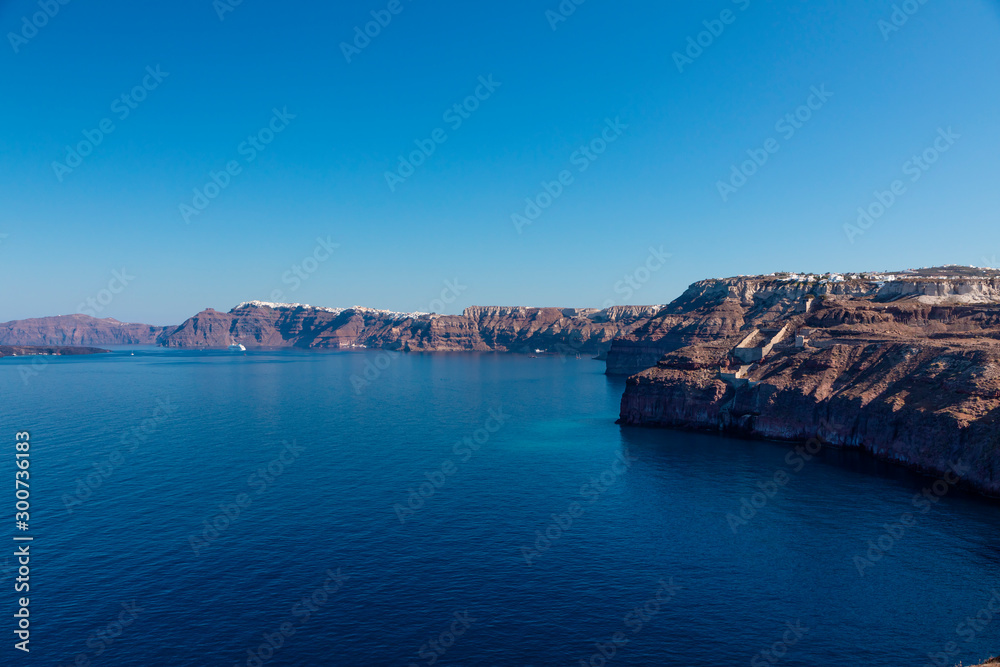A cruise ship on the blue Aegean Sea near Santorini Island in the Greek Islands