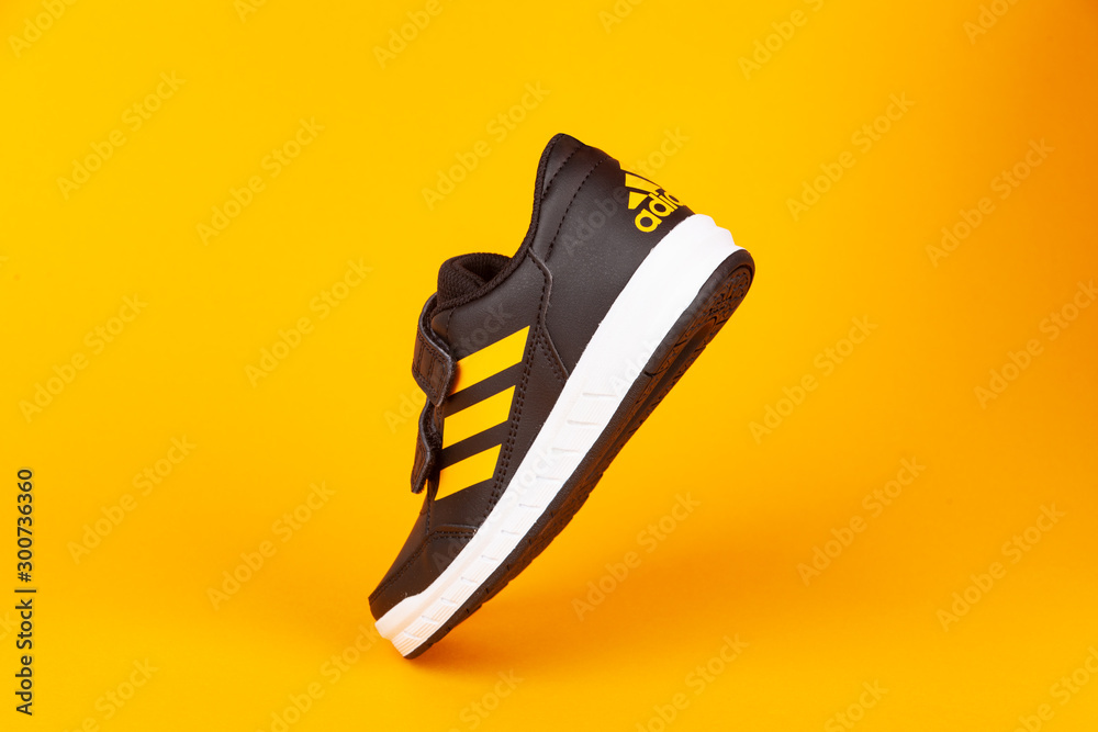 Varna , Bulgaria - AUGUST 13, 2019 : ADIDAS ALTA SPORT shoe, on yellow  background. Product shot. Adidas is a German corporation that designs and  manufactures sports shoes, clothing and accessories Stock Photo | Adobe  Stock