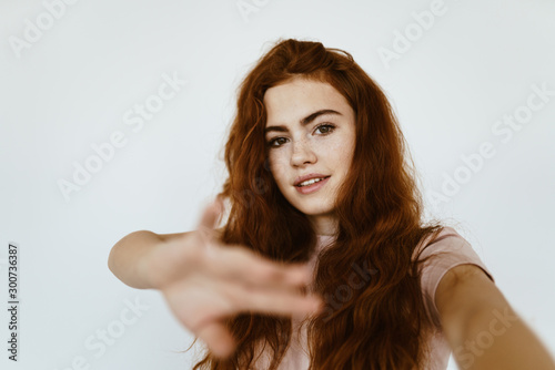 schoolgirl with a firm confident look makes a negative gesture to her hand