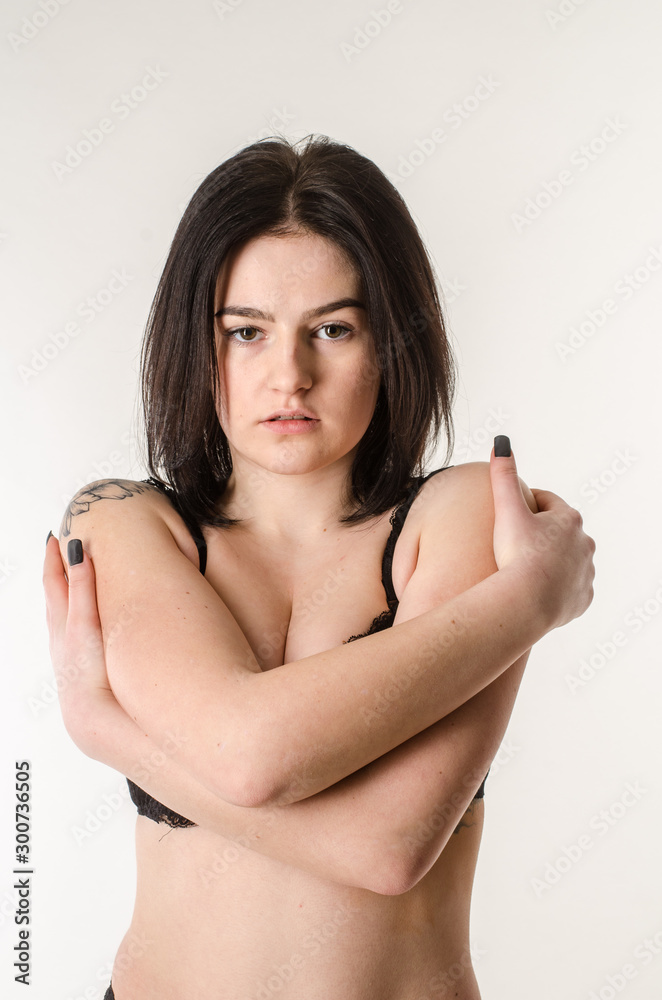 Fototapeta premium Beautiful and sexy woman wearing blue lingerie isolated on white