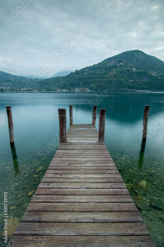 Jetty at lake Orta  Italy in the morning.