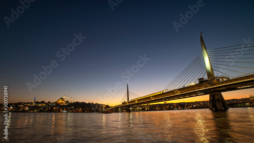 Halic Metro Bridge And Golden Horn At Night, Istanbul, Turkey photo