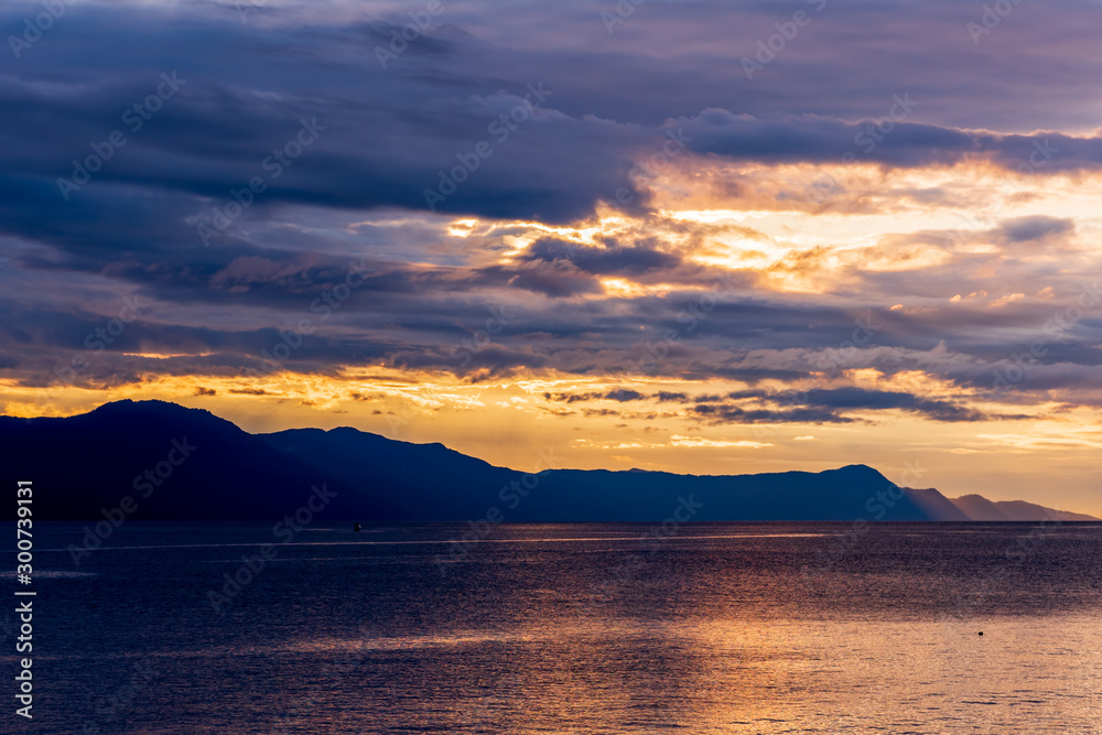 Ocean sunset over mountains in beautiful British Columbia. Canada.