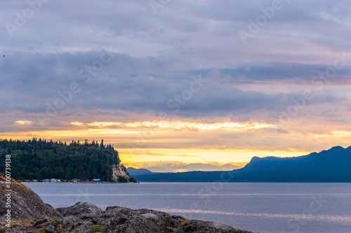 Ocean sunset over mountains in beautiful British Columbia. Canada.