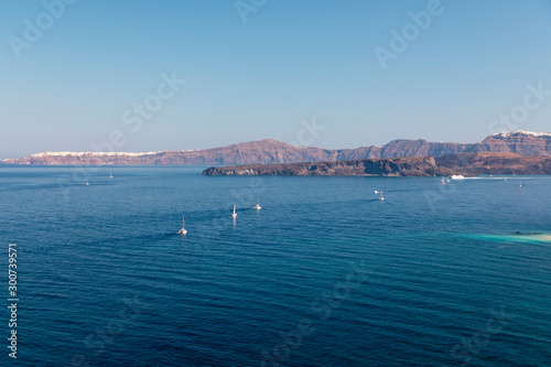 Yachts and sailing boats on the Aegean Sea in the Greek Islands near Santorini Island © Phillip