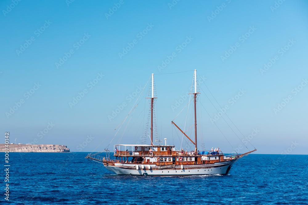 Yachts and sailing boats on the Aegean Sea in the Greek Islands near Santorini Island