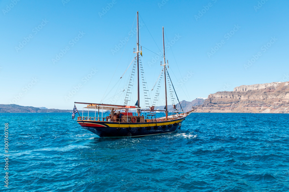 Yachts and sailing boats on the Aegean Sea in the Greek Islands near Santorini Island Yachts and sailing boats on the Aegean Sea in the Greek Islands near Santorini Island