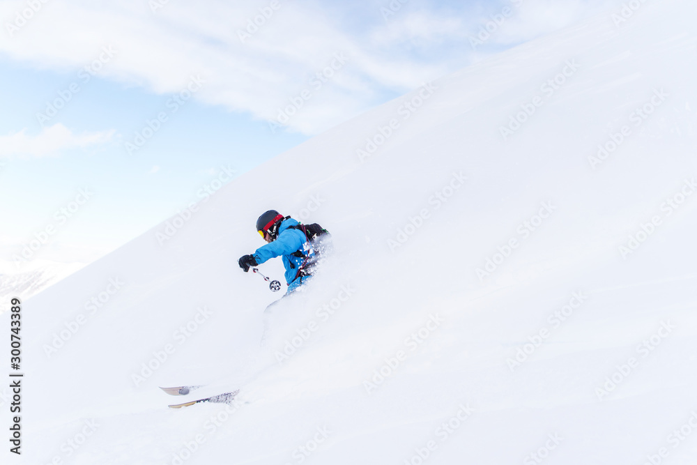 Side photo of sportsman skiing Side photo of sportsman skiing