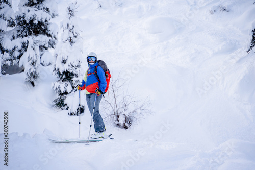 Athlete woman skiing on snowy slope.