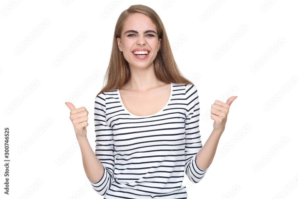 Young beautiful girl showing thumbs up on white background Young beautiful girl showing thumbs up on white background