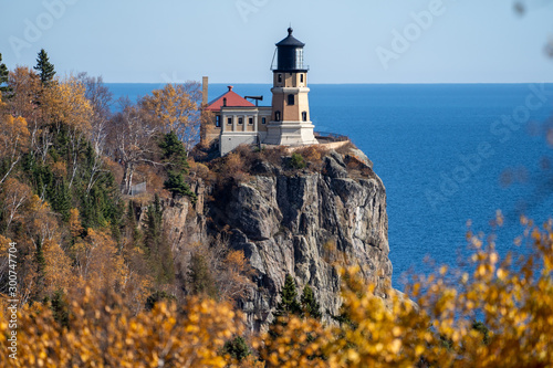 Natural framing of Split Rock Lighthouse on the North Shore of Minnesota, framed by fall leaves