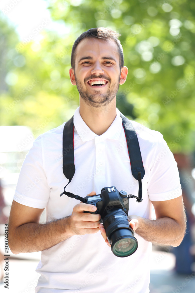 Young photographer with camera in the city Young photographer with camera in the city