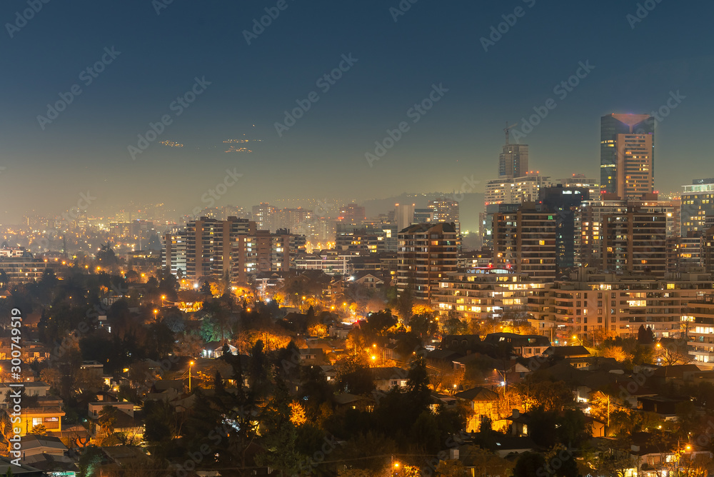Night lights of Santiago and villages at the andes mountains