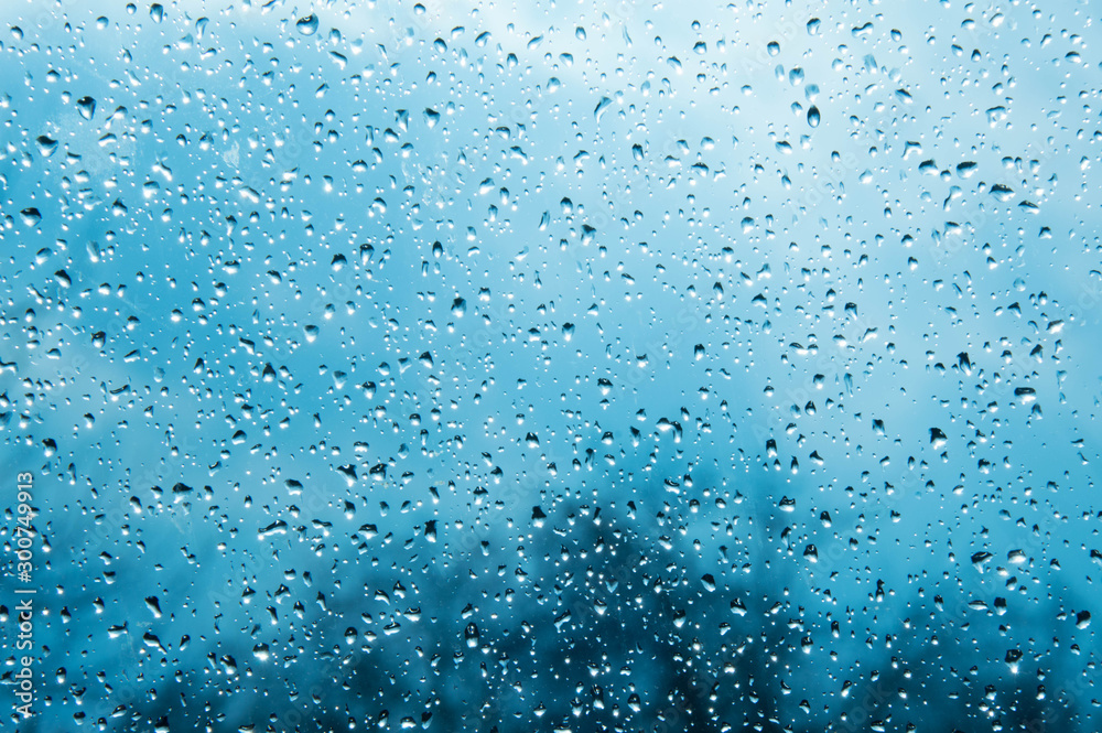 Beautiful sky and clouds, rain, wet glass, drops of water on the glass, drops of water on the window, drops Beautiful sky and clouds, rain, wet glass, drops of water on the glass, drops of water on the window, drops