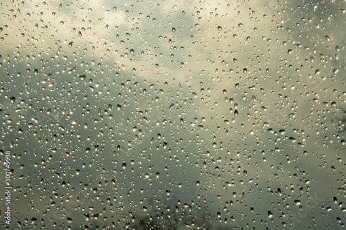 Beautiful sky and clouds  rain  wet glass  drops of water on the glass  drops of water on the window  drops