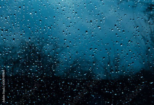 Beautiful sky and clouds  rain  wet glass  drops of water on the glass  drops of water on the window  drops