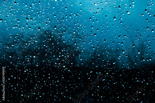 Beautiful sky and clouds, rain, wet glass, drops of water on the glass, drops of water on the window, drops