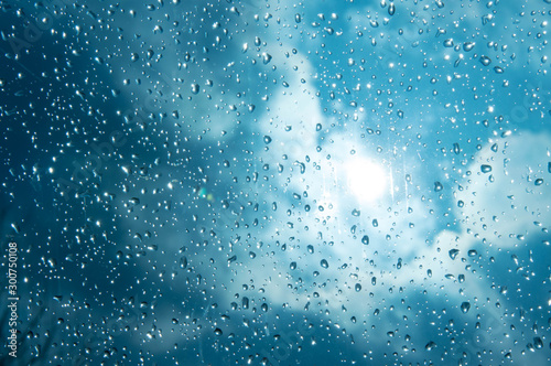 Beautiful sky and clouds, rain, wet glass, drops of water on the glass, drops of water on the window, drops