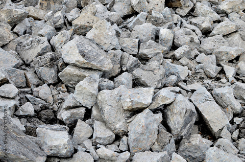 Recycling and reuse crushed concrete rubble, asphalt, building material, blocks. Broken concrete slabs at construction site. Сoncrete rubble from demolition at landfill. Hardcore waste recycling