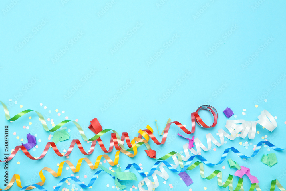 Colorful ribbons with confetti on blue background Colorful ribbons with confetti on blue background