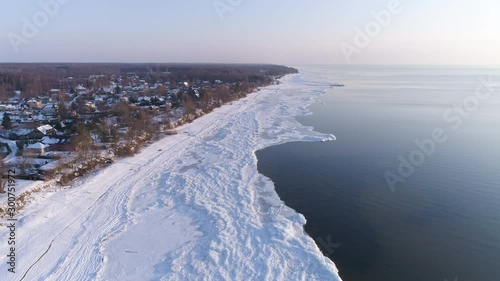 Wallpaper Mural Small town by the sea in Latvia, frozen ice on shore - aerial drone shot Torontodigital.ca