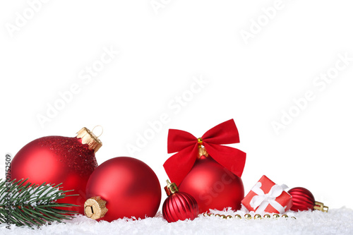 Christmas balls with fir tree branch and gift box on white background