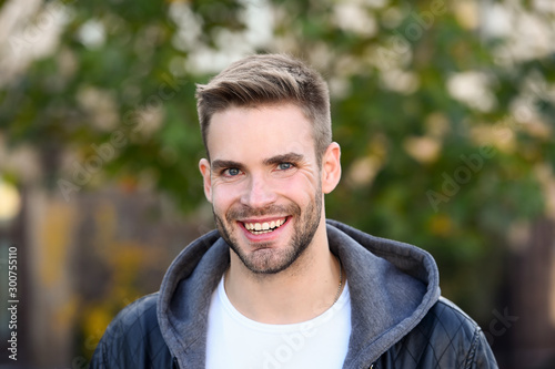 This is what man wants to look like. Happy man on autumn day. Handsome man smile in casual style. Caucasian man with unshaved beard hair and stylish haircut. Autumn fashion. Lifestyle