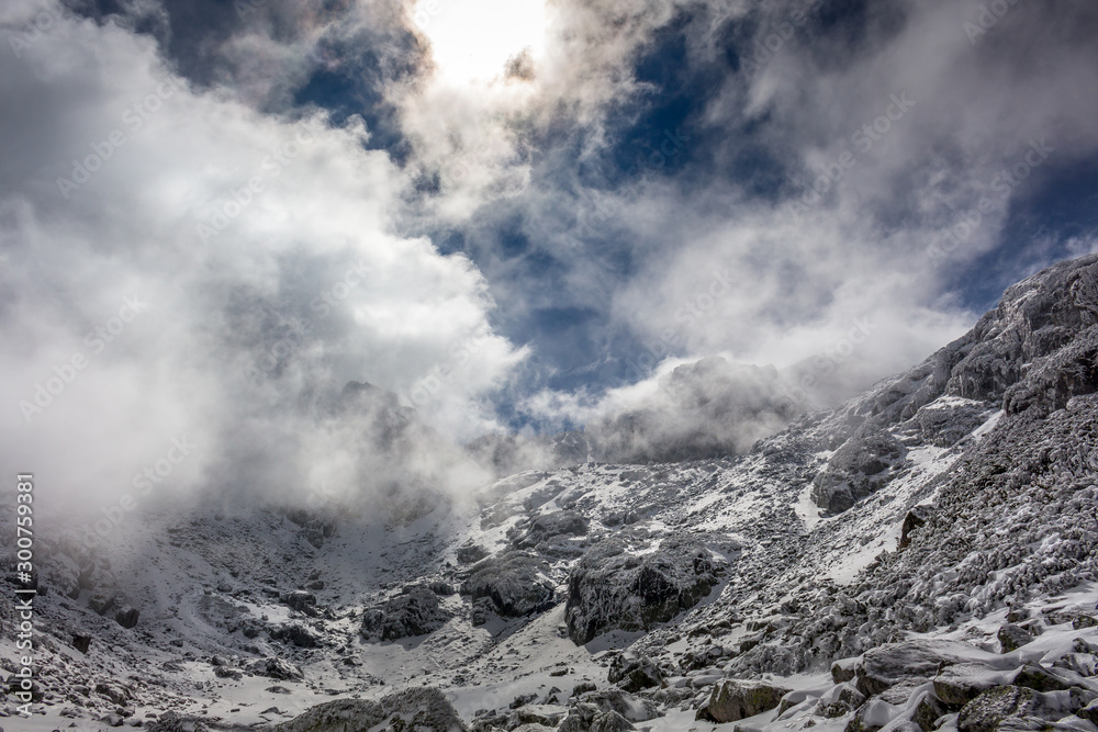 Beautiful winter view with dramatic clouds at the Rila mountain in Bulgaria, Maliovica.