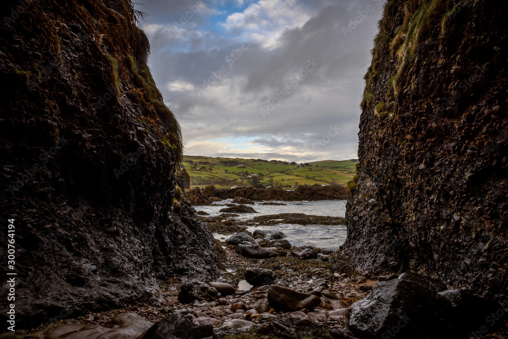 Obraz premium Cushendun Cave in Northern Ireland, county of Antrim, which was used as a filming location in Game of Thrones TS series.