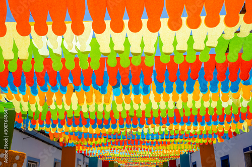 Street fully decorated with multicolored paper in Redondo village, Portugal.