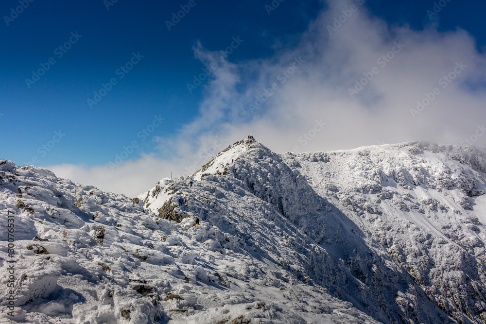 Hiking to the Maliovica summit after a cold winter storm at the Rila mountain in Bulgaria, Maliovica. Hiking to the Maliovica summit after a cold winter storm at the Rila mountain in Bulgaria, Maliovica.