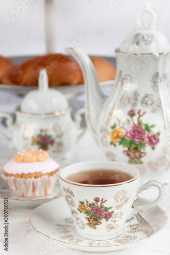 tea set with dessert and bread