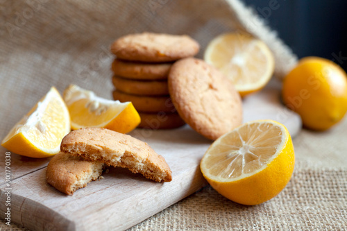 lemon cookies made at home, citrus baking deliciously lies on a table in a paper wrapper, a recipe for fruit baking