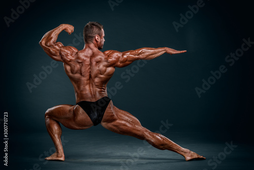 Bodybuilding Competitor Posing and Flexing Muscles