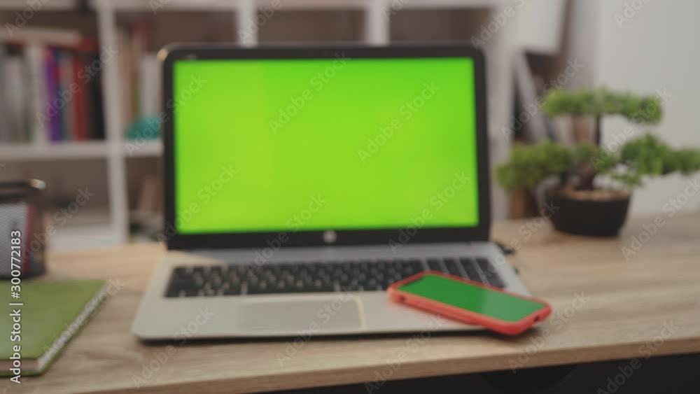 Close up laptop computer with green screen chroma key display internet business office technology work desk connection keyboard pc device using slow motion Close up laptop computer with green screen chroma key display internet business office technology work desk connection keyboard pc device using slow motion