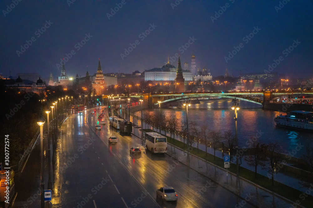 Awe view on Kremlin and Moscow river at night. Rain.