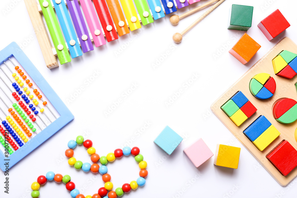 Colorful kids toys on white background. Top view, flat lay. Colorful kids toys on white background. Top view, flat lay.