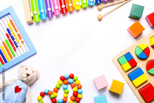 Colorful kids toys on white background. Top view, flat lay.