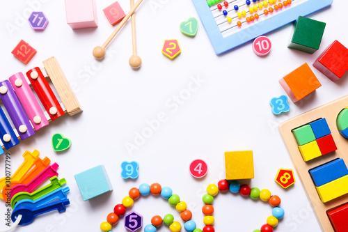 Colorful kids toys on white background. Top view  flat lay.