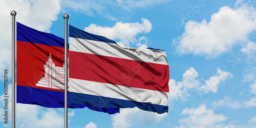 Cambodia and Costa Rica flag waving in the wind against white cloudy blue sky together. Diplomacy concept, international relations.