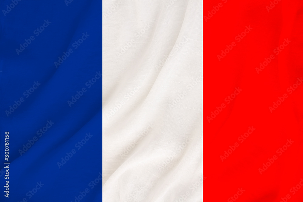 national flag of the country france on gentle silk with wind folds, travel concept, immigration, politics, copy space, close-up