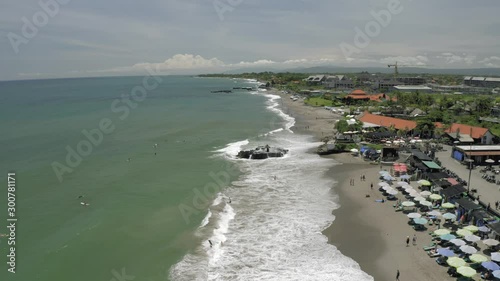 Surfing in Batu Balong beach Bali Island 4K Drone flight photo