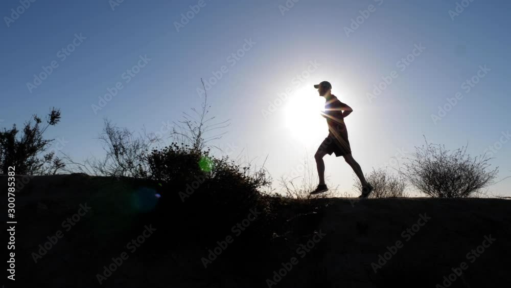A man going for his moring workout in the hills above Hallywood A man going for his moring workout in the hills above Hallywood