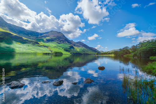 Canvas Print Mountains reflected on a lake at the Lake District in England