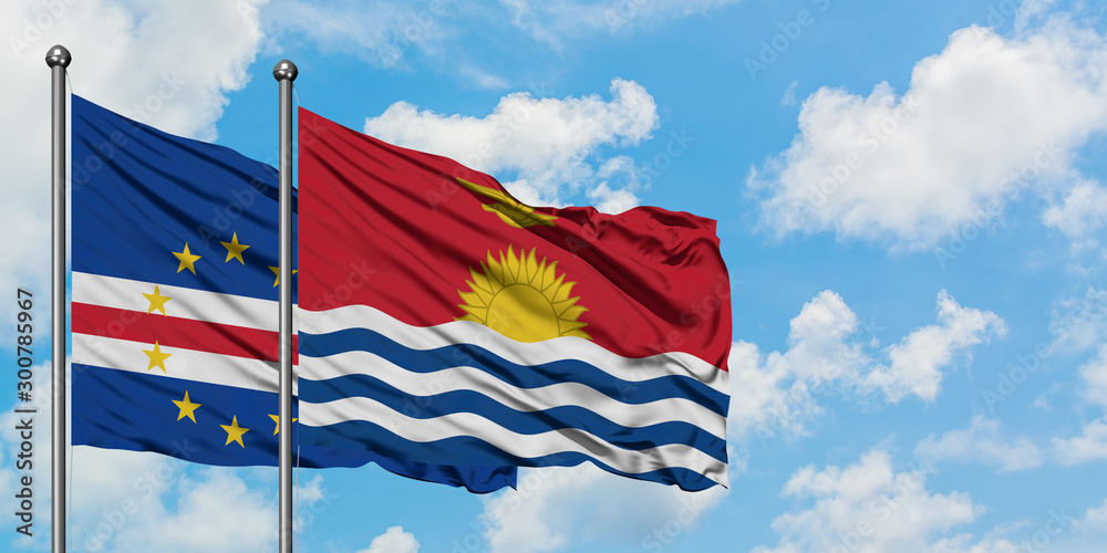 Cape Verde and Kiribati flag waving in the wind against white cloudy blue sky together. Diplomacy concept, international relations.