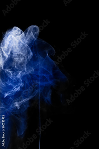 Blue smoke movement On a black background. Smoke background. Abstract smoke on a black background.