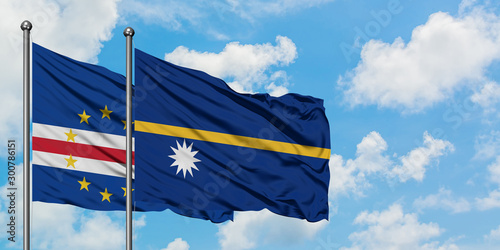 Cape Verde and Nauru flag waving in the wind against white cloudy blue sky together. Diplomacy concept, international relations.